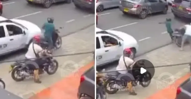 En video, un motociclista robó a una mujer y luego un ciudadano lo derribó: en el forcejeo, el hijo de la víctima del hurto recibió un disparo en Cali